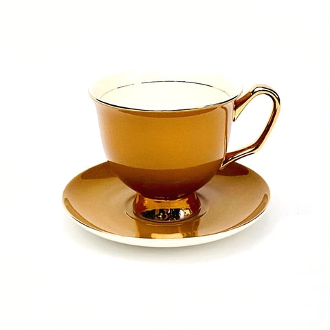Mustard tea cup and saucer