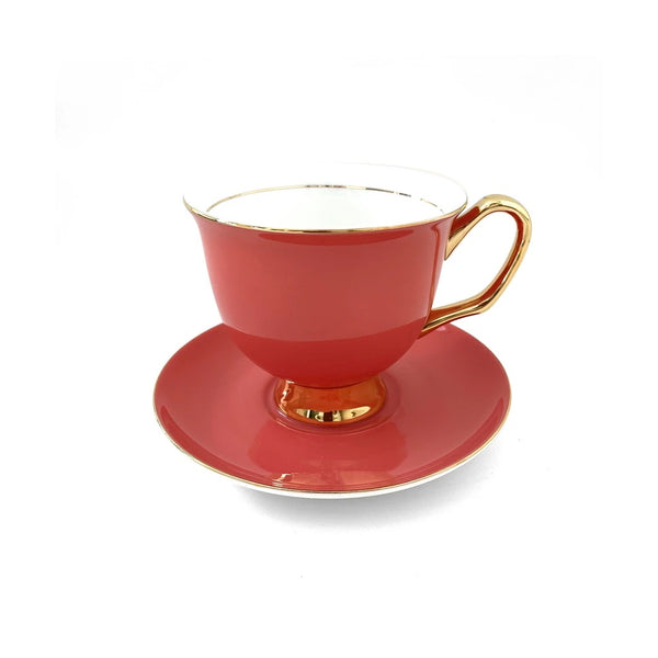 Crimson tea cup and saucer